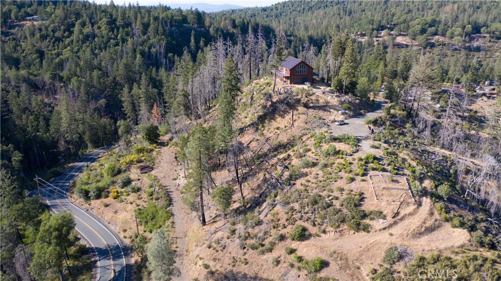 13627 View Road Cobb, CA 95426 - Photo 3 of 27 a view of a lake with large trees