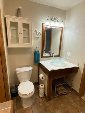 a kitchen with a refrigerator and cabinets