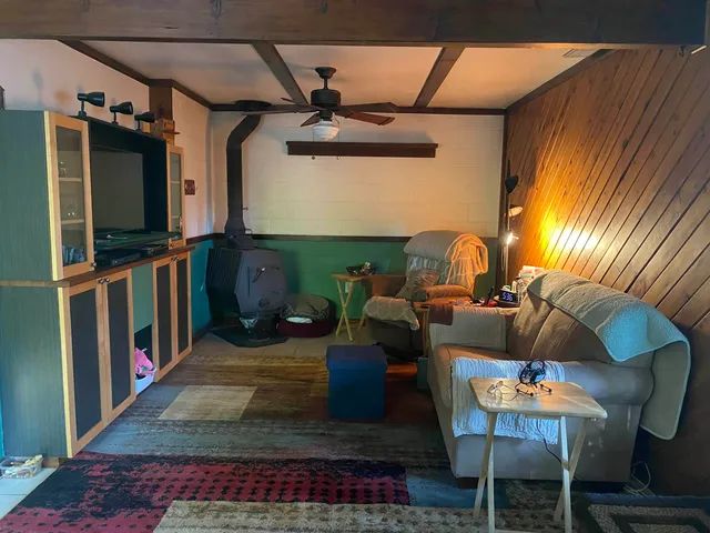 a kitchen with a sink a stove and cabinets