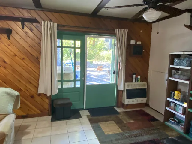 an empty room with wooden floor and closet