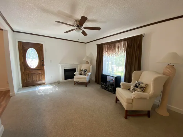 a living room with furniture and a window