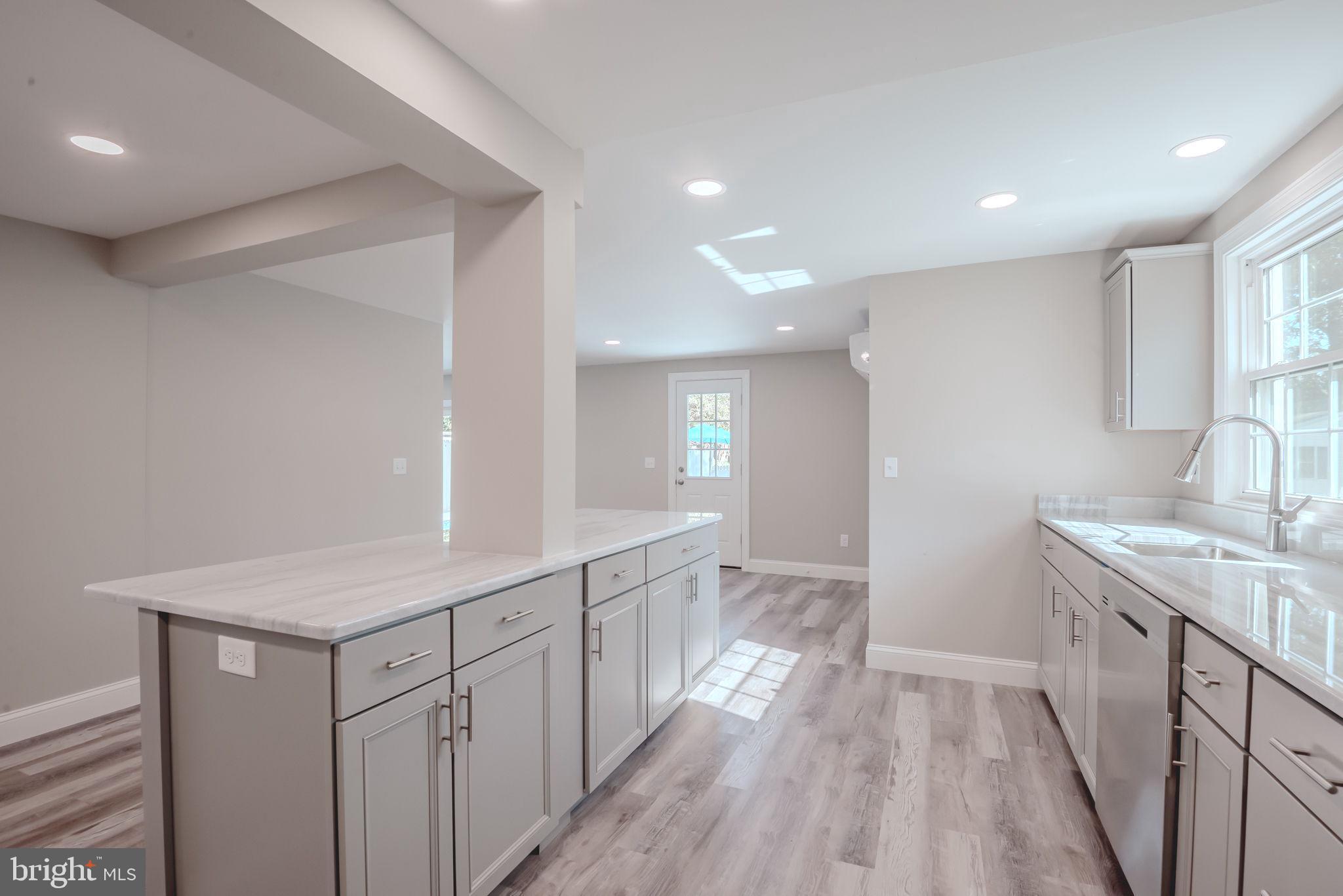 319 Union Street Milton, DE 19968 - Photo 12 of 61 a bathroom with a sink a mirror and a shower