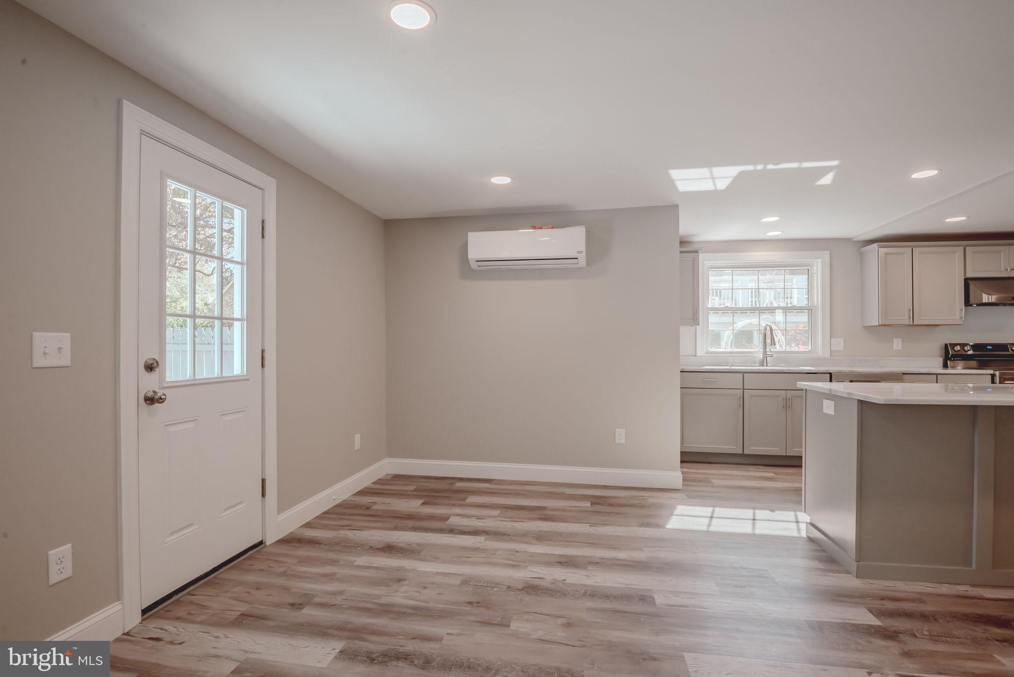 319 Union Street Milton, DE 19968 - Photo 15 of 61 a view of a kitchen with a sink cabinets and wooden floor