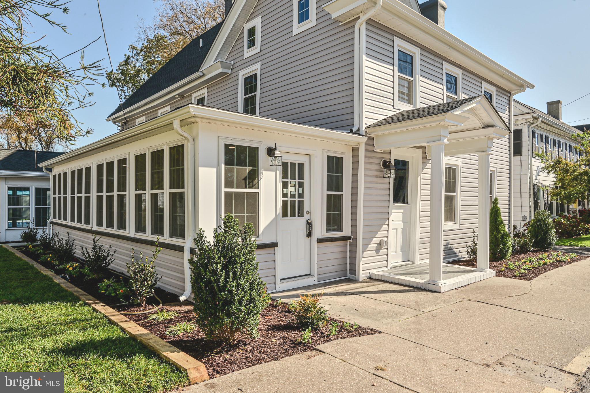 319 Union Street Milton, DE 19968 - Photo 2 of 61 a front view of a house with garden