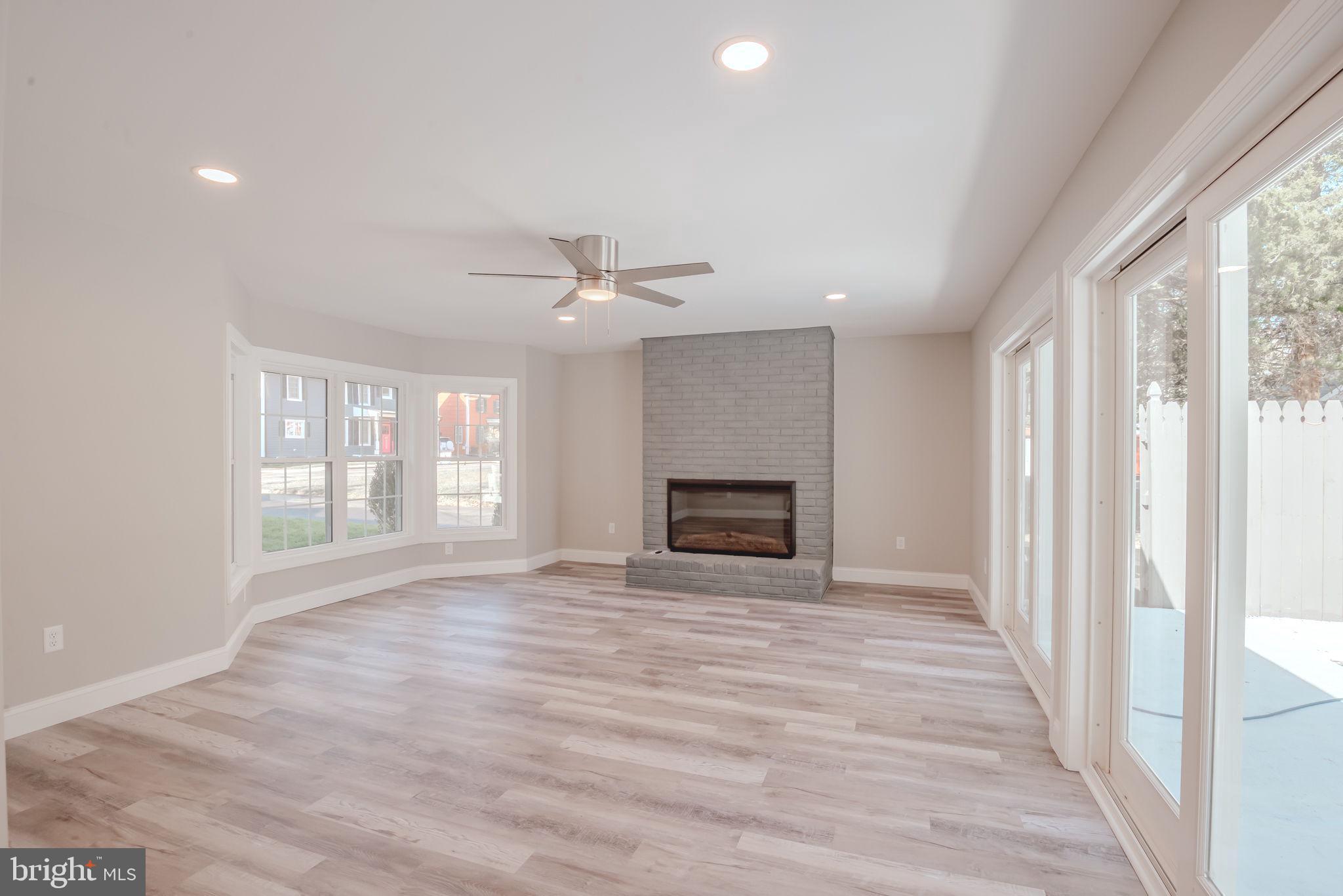 319 Union Street Milton, DE 19968 - Photo 31 of 61 a view of a livingroom with a ceiling fan and window