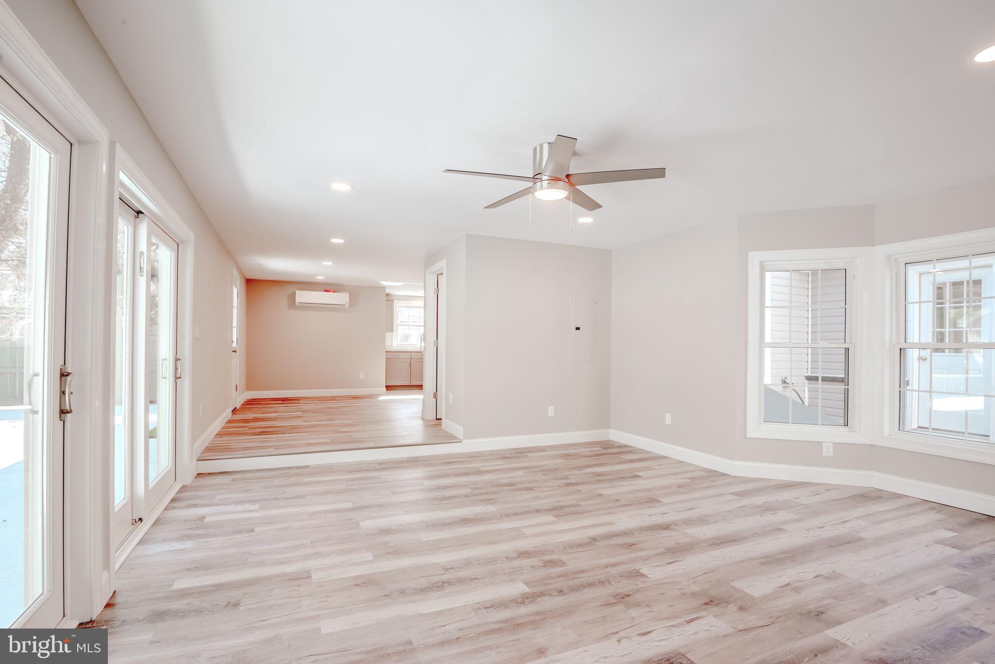 319 Union Street Milton, DE 19968 - Photo 34 of 61 a view of an empty room with wooden floor and a window