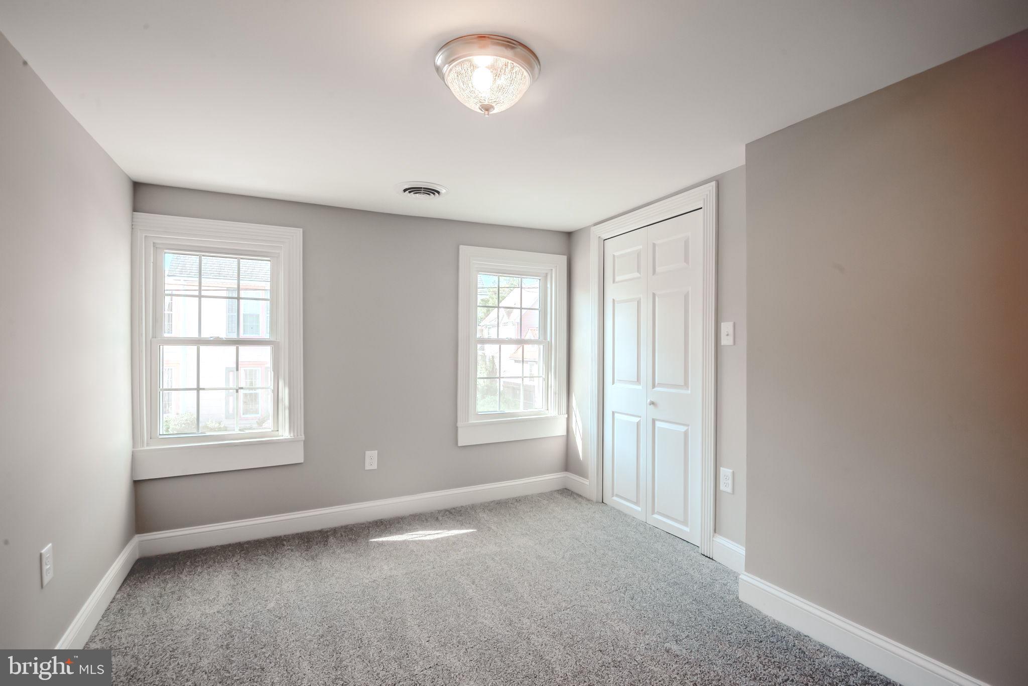319 Union Street Milton, DE 19968 - Photo 43 of 61 an empty room with windows