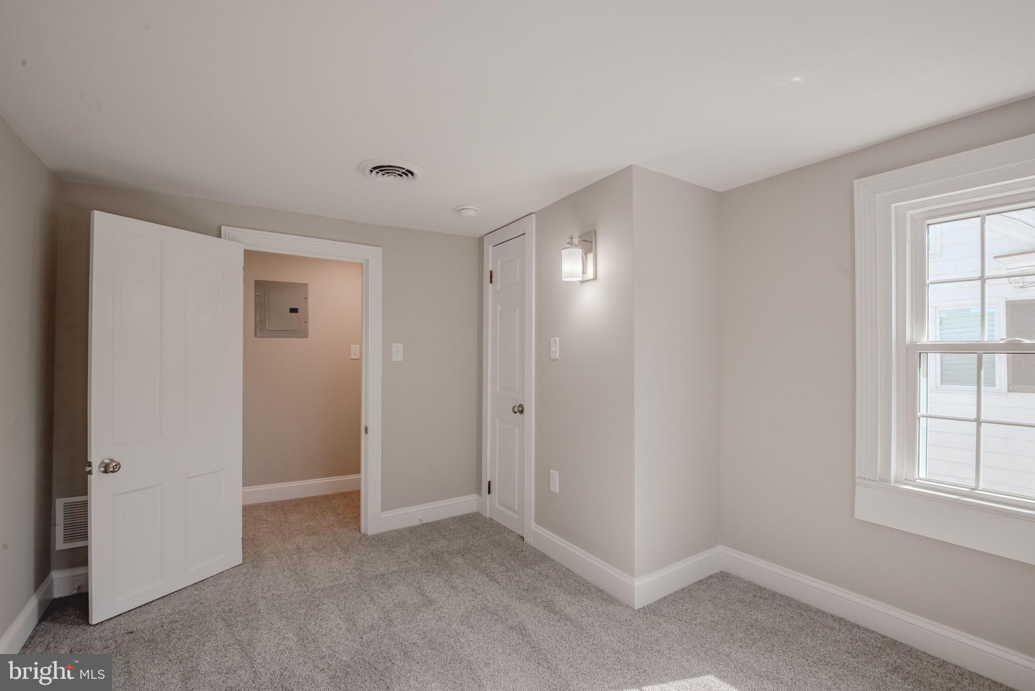 319 Union Street Milton, DE 19968 - Photo 45 of 61 an empty room with windows