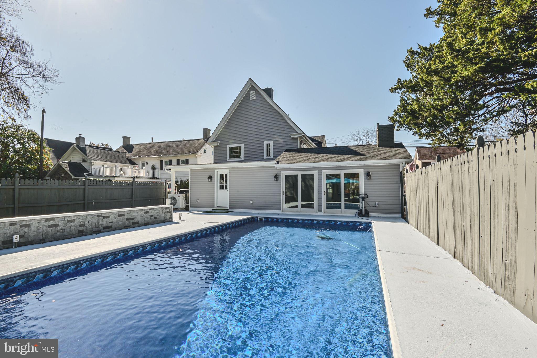 319 Union Street Milton, DE 19968 - Photo 52 of 61 a front view of a house with a yard