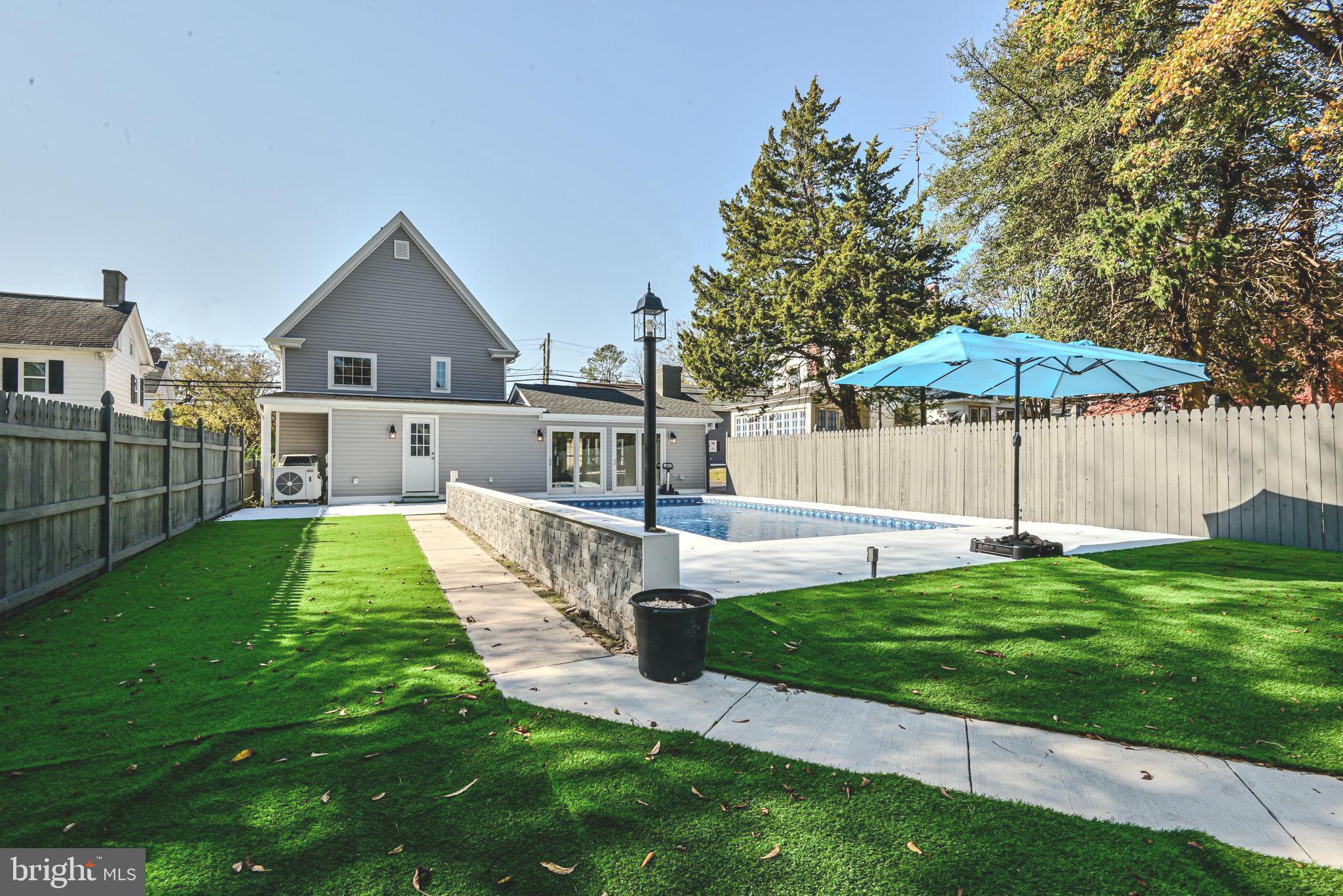 319 Union Street Milton, DE 19968 - Photo 6 of 61 a view of a house with a yard patio and a slide