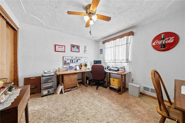 a bedroom with a workspace