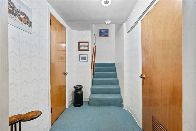 a bed room with furniture and a large window