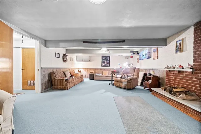 a bedroom with furniture and a fireplace