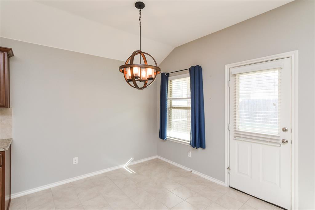 1406 Slate Street Princeton, TX 75407 - Photo 12 of 25 a view of empty room with wooden floor and fan