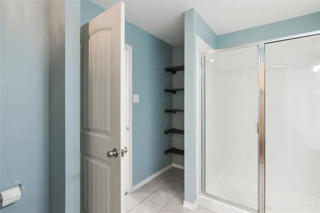 a view of a bathroom from a hallway