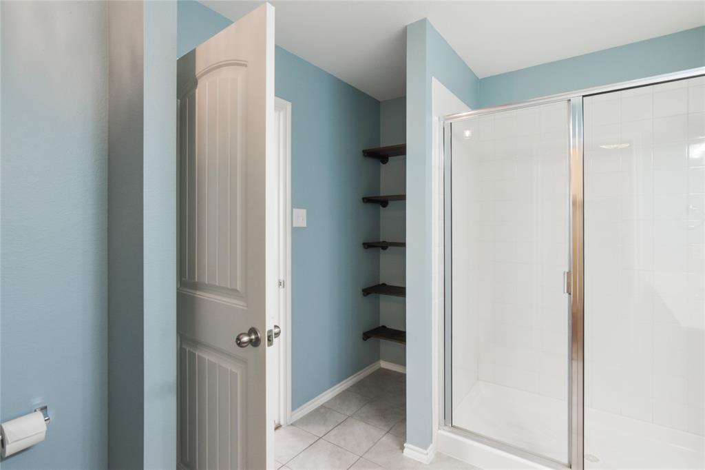 1406 Slate Street Princeton, TX 75407 - Photo 13 of 25 a view of a bathroom from a hallway