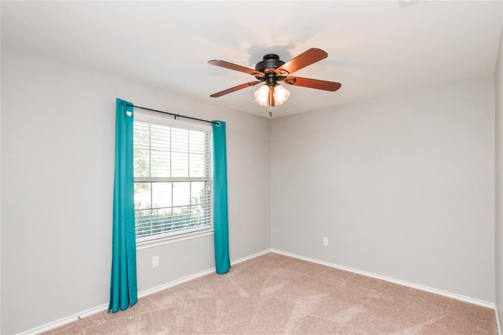 1406 Slate Street Princeton, TX 75407 - Photo 19 of 25 a view of an empty room with a window