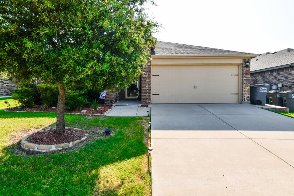1406 Slate Street Princeton, TX 75407 - Photo 2 of 25 a view of a backyard with a garden and plants