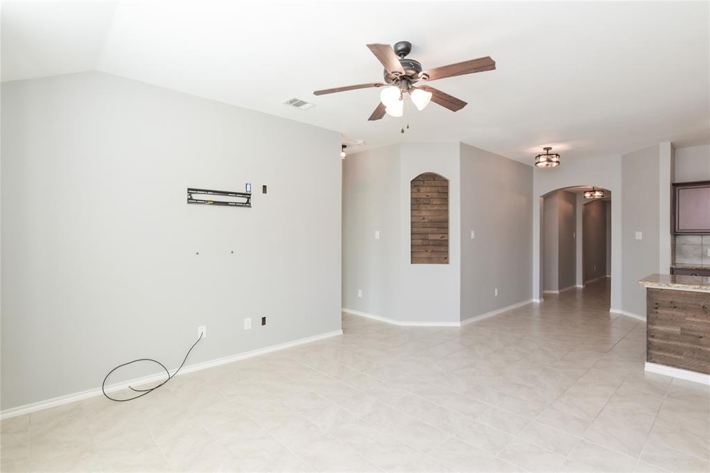 1406 Slate Street Princeton, TX 75407 - Photo 9 of 25 a view of a livingroom with a ceiling fan