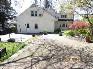a front view of a house with a yard and a garage