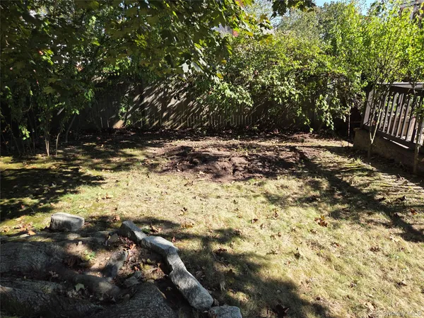 a view of outdoor space with deck and yard