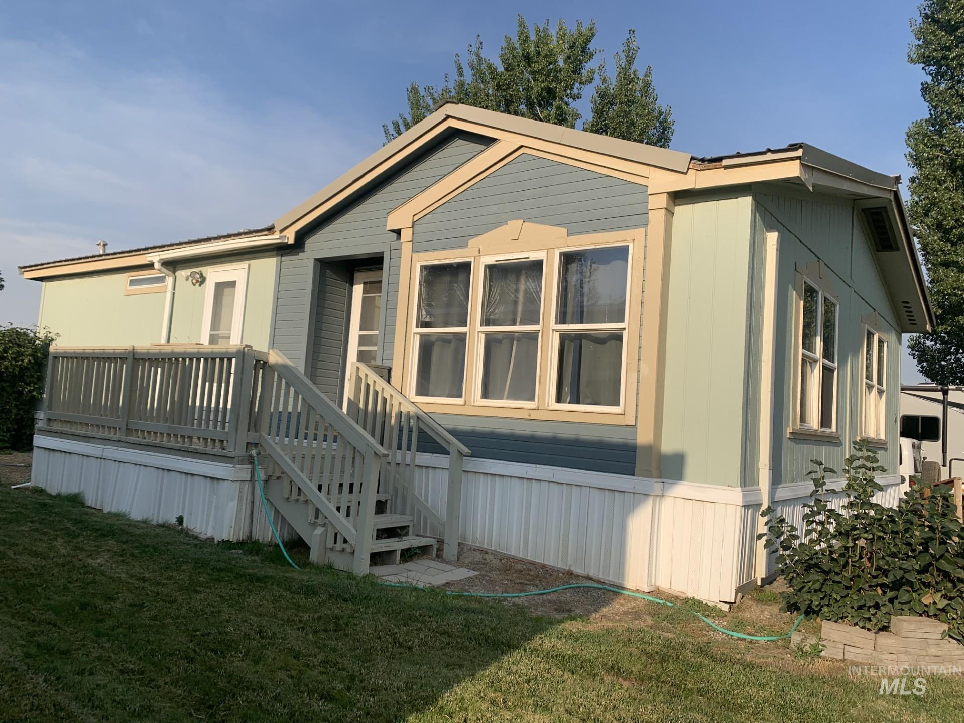 1220 North 4th Street, Unit 64 Parma, ID 83660 - Photo 1 of 1 Manufactured / mobile home featuring a front lawn