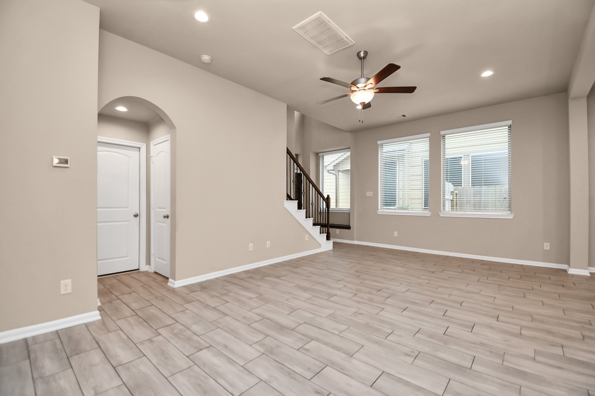 4220 Merry Mill Drive Spring, TX 77386 - Photo 11 of 44 wooden floor in an empty room with a window