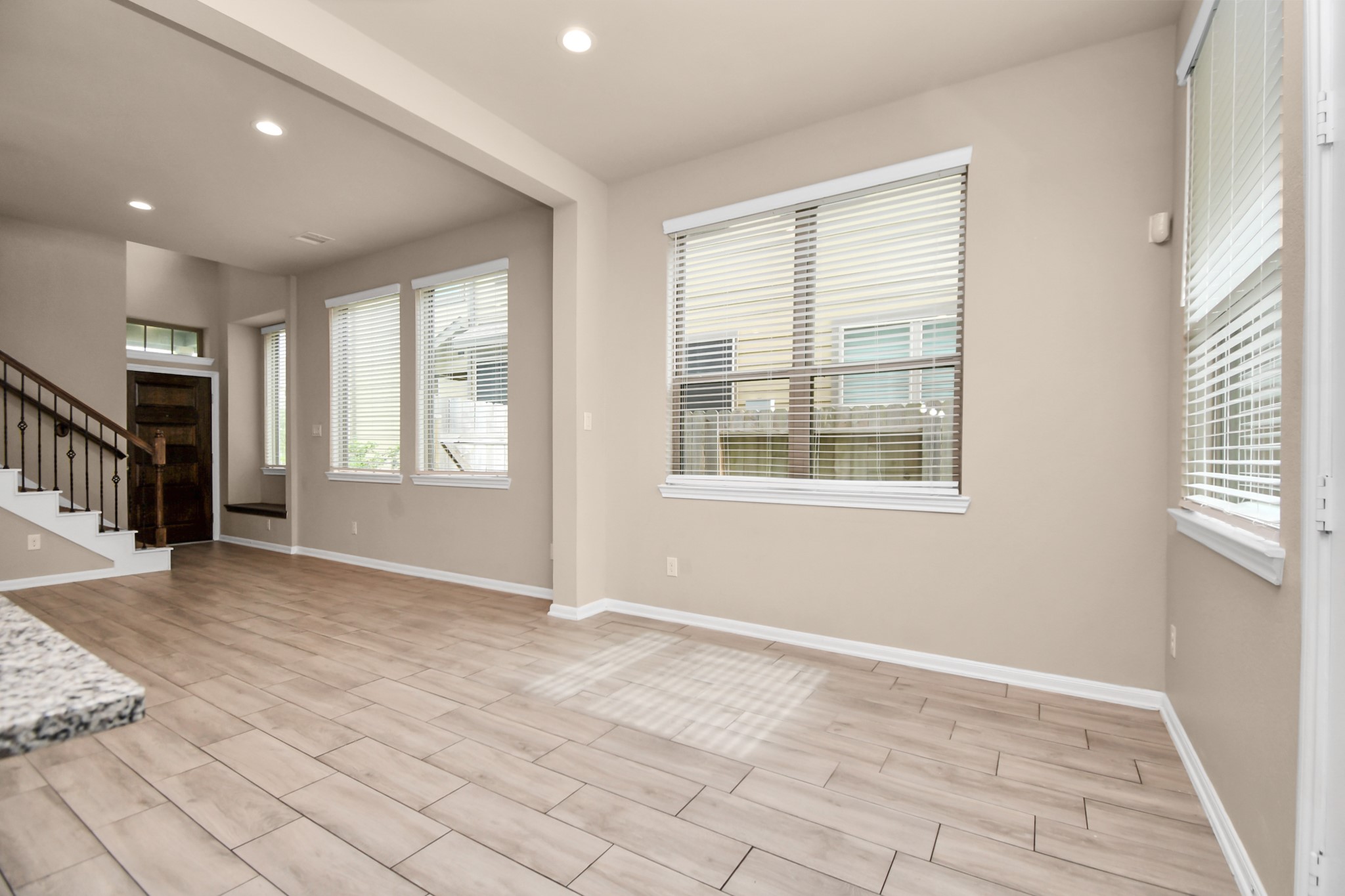 4220 Merry Mill Drive Spring, TX 77386 - Photo 16 of 44 a view of an empty room with a window and wooden floor