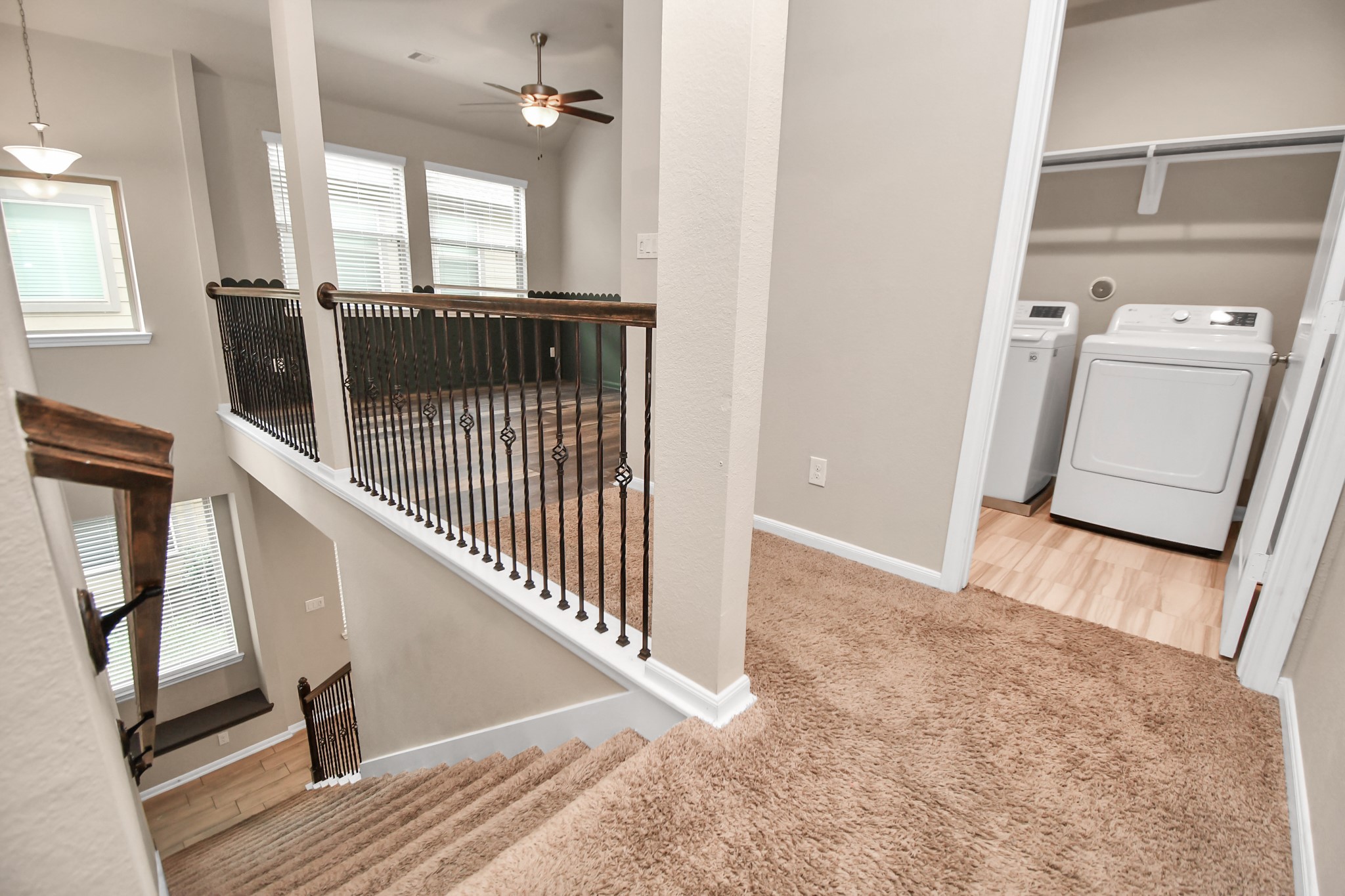 4220 Merry Mill Drive Spring, TX 77386 - Photo 18 of 44 a view of a hallway view with wooden floor and staircase