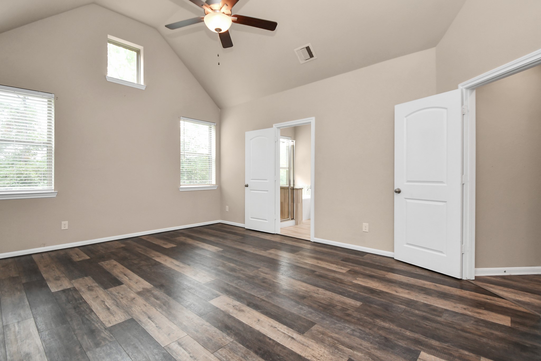 4220 Merry Mill Drive Spring, TX 77386 - Photo 23 of 44 a view of an empty room with wooden floor and a window