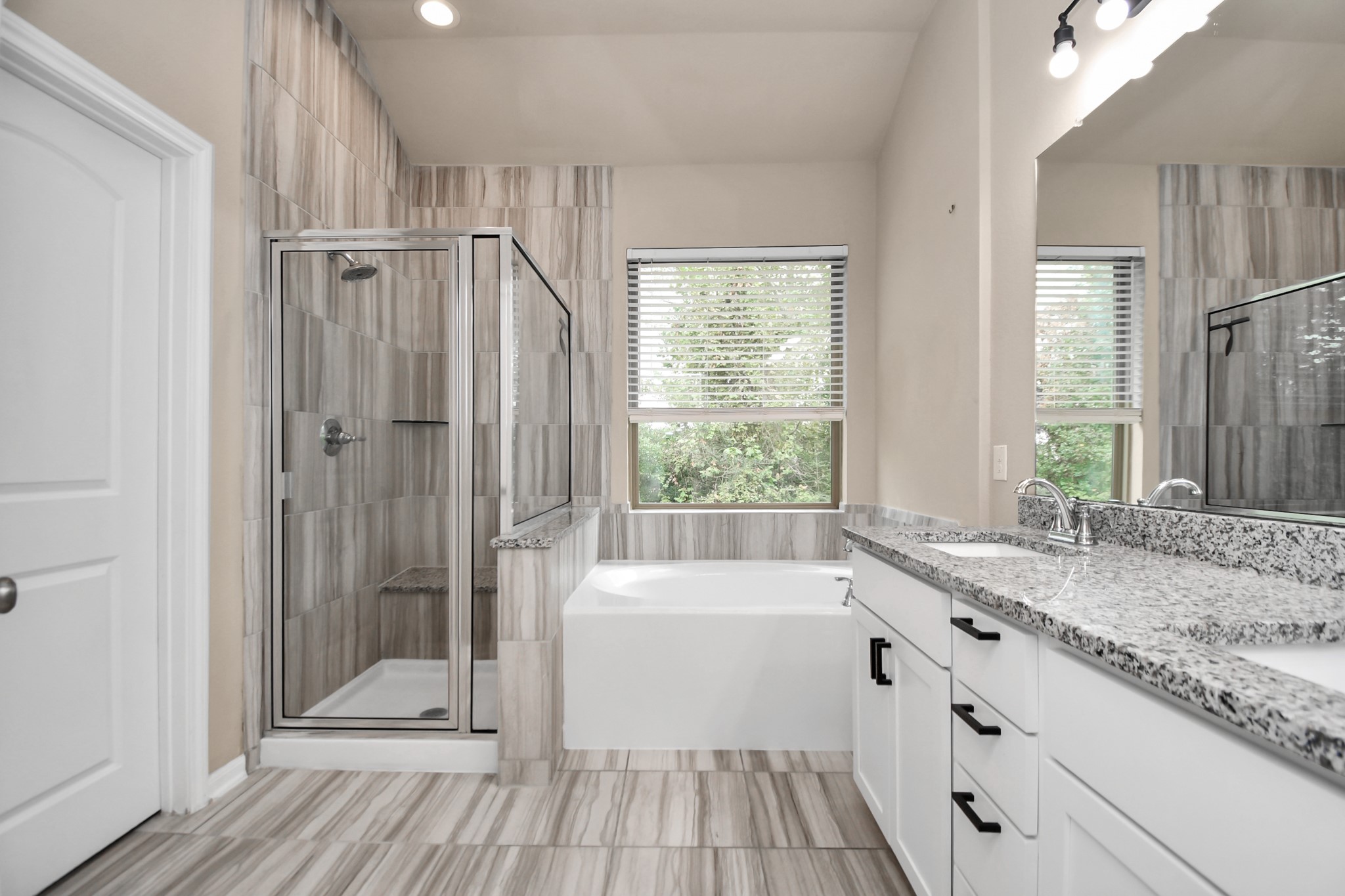 4220 Merry Mill Drive Spring, TX 77386 - Photo 26 of 44 a bathroom with a granite countertop sink a toilet and shower