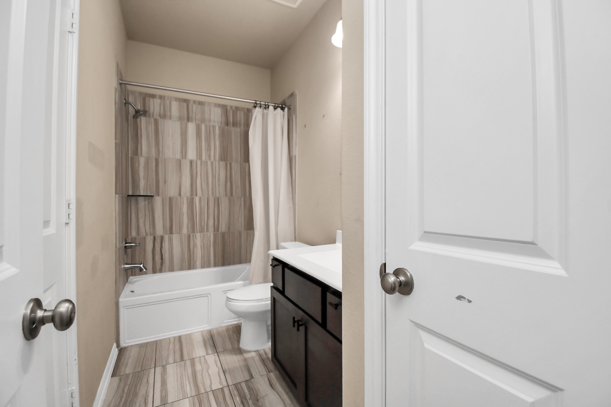 4220 Merry Mill Drive Spring, TX 77386 - Photo 32 of 44 a bathroom with a bathtub a sink and a shower