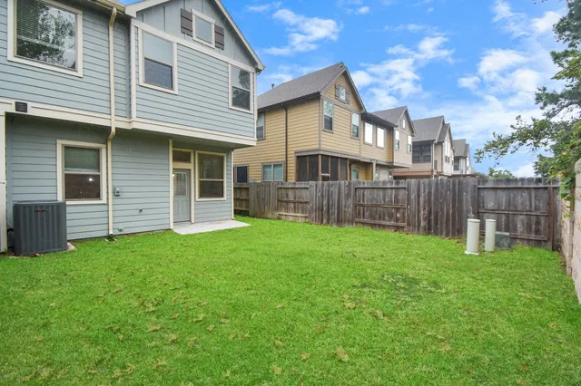 a view of a house with a yard and porch