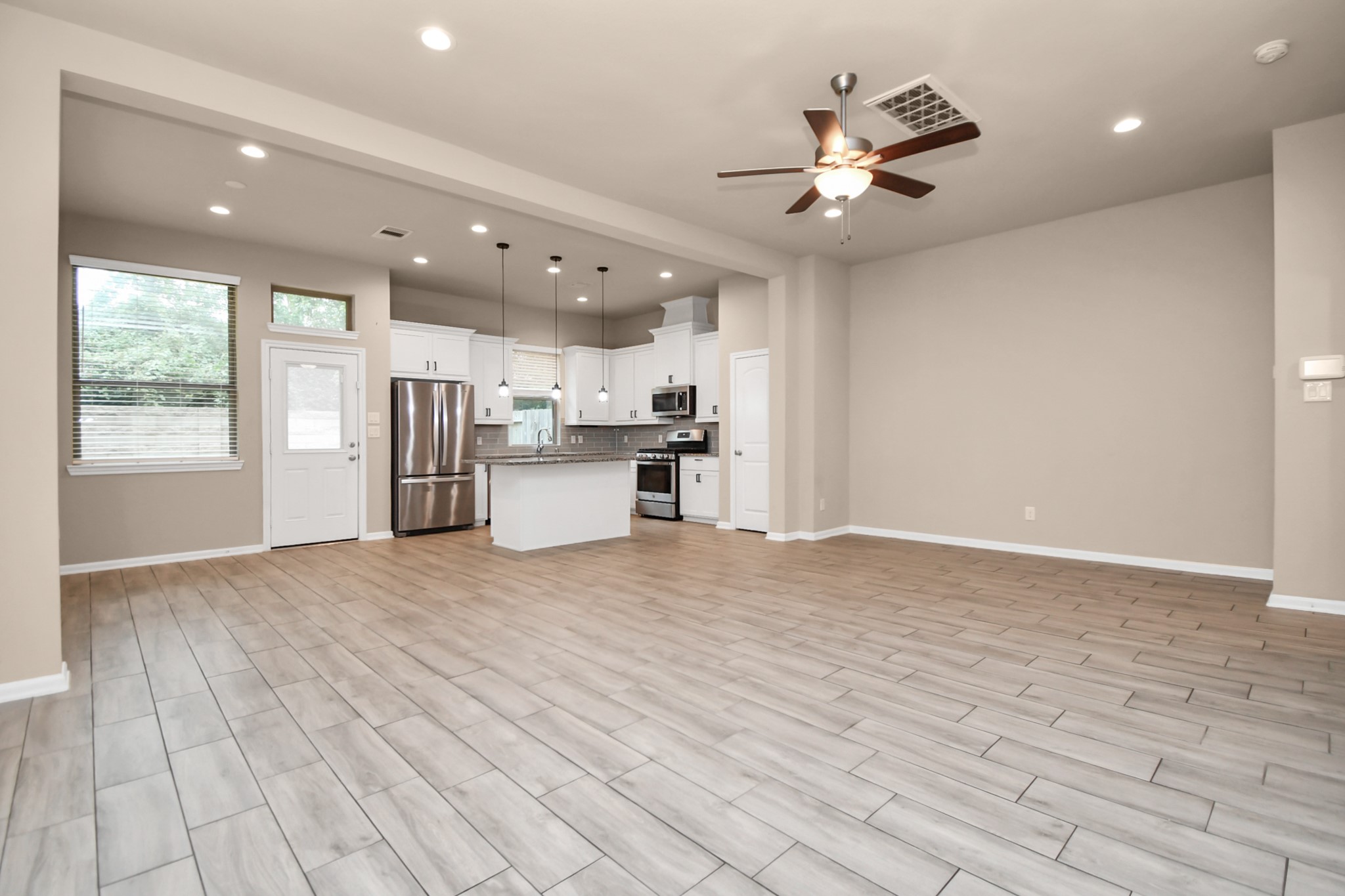 4220 Merry Mill Drive Spring, TX 77386 - Photo 7 of 44 a view of a kitchen with a sink and a window