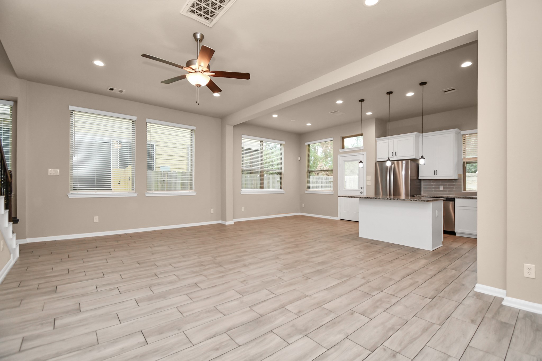 4220 Merry Mill Drive Spring, TX 77386 - Photo 10 of 44 a view of an empty room with kitchen and window