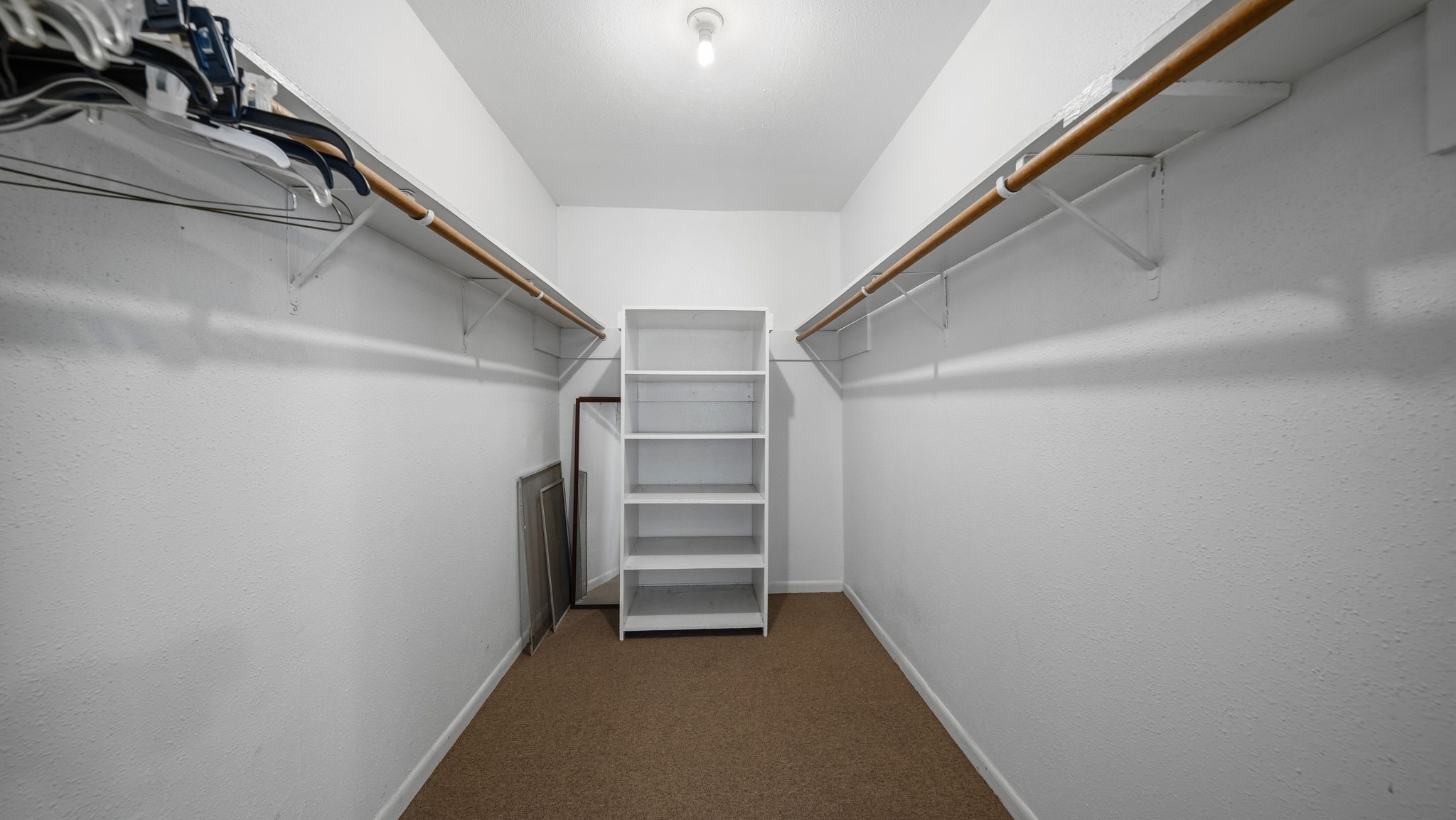 4027 Spring Branch Road Montgomery, TX 77316 - Photo 13 of 19 Primary closet with built-in storage.