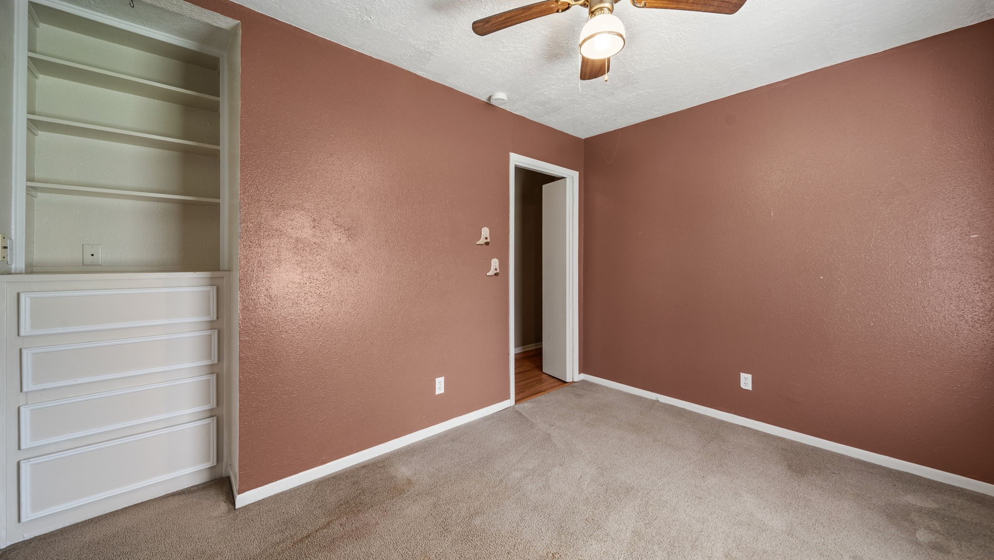 4027 Spring Branch Road Montgomery, TX 77316 - Photo 8 of 19 Built-ins in this spacious secondary bedroom.
