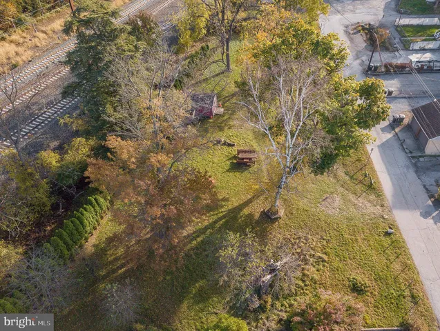 a bathroom with a small yard and covered with trees