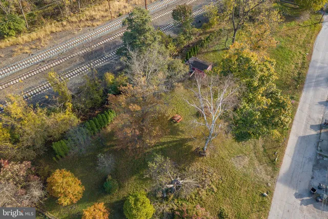 a bathroom with a small yard and covered with trees