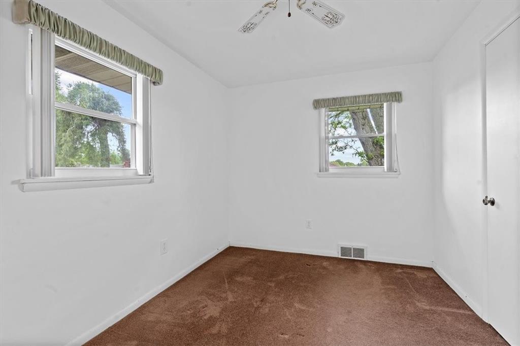726 Winfield Road Cabot, PA 16023 - Photo 12 of 25 an empty room with windows
