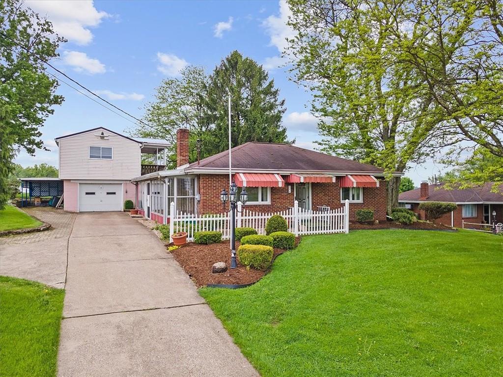 726 Winfield Road Cabot, PA 16023 - Photo 2 of 25 a view of a house with a yard