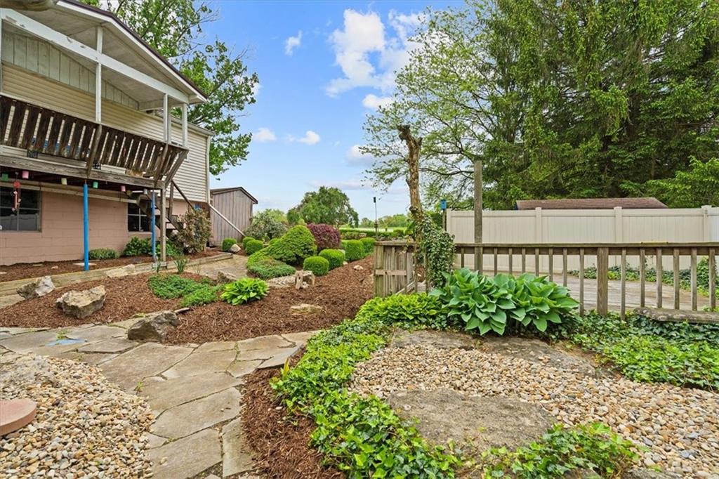 726 Winfield Road Cabot, PA 16023 - Photo 21 of 25 a front view of a house with garden