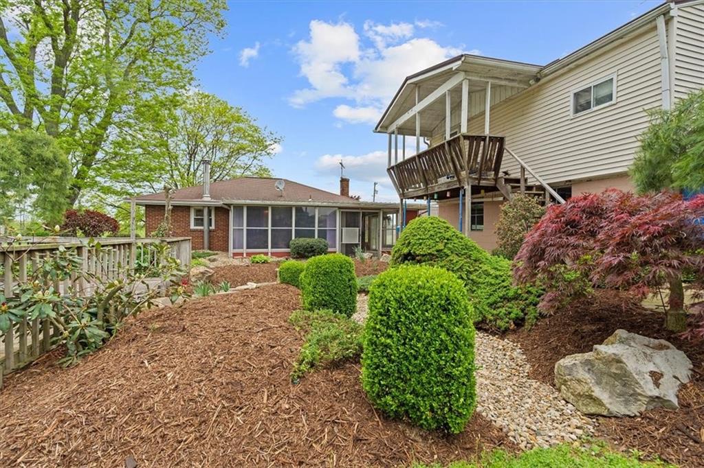 726 Winfield Road Cabot, PA 16023 - Photo 22 of 25 a front view of a house with a yard