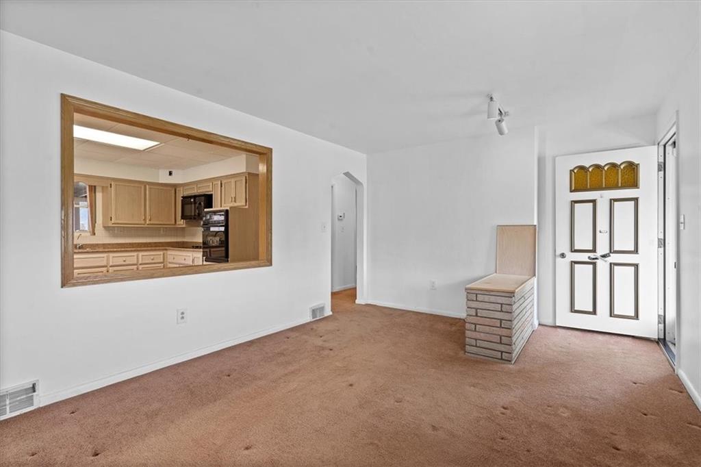 726 Winfield Road Cabot, PA 16023 - Photo 4 of 25 a view of an empty room with a window