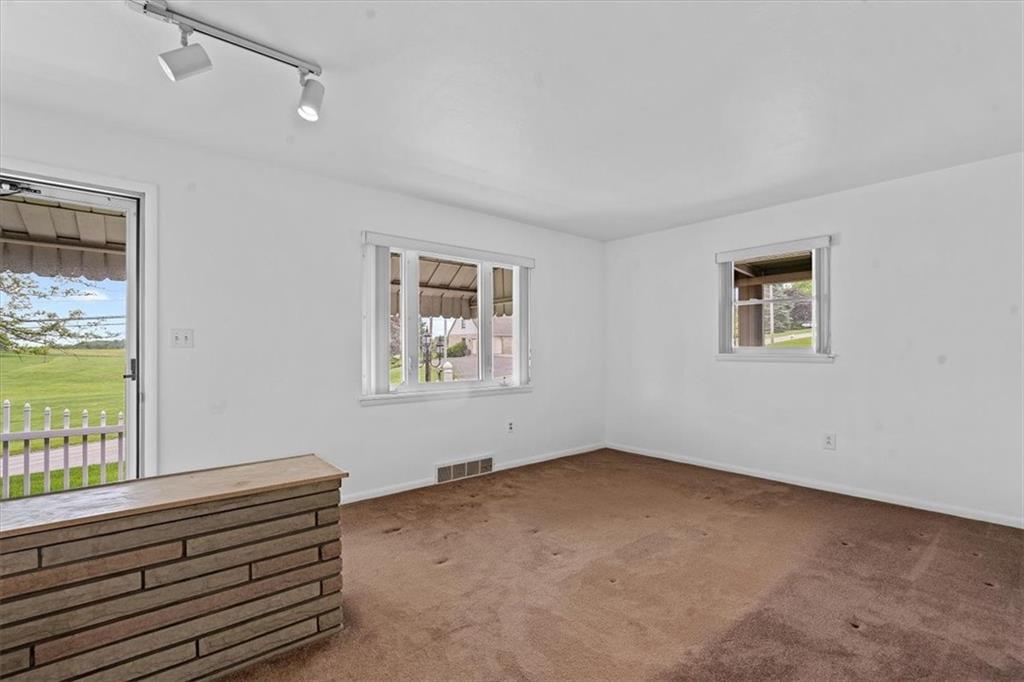 726 Winfield Road Cabot, PA 16023 - Photo 5 of 25 a view of an empty room with a window