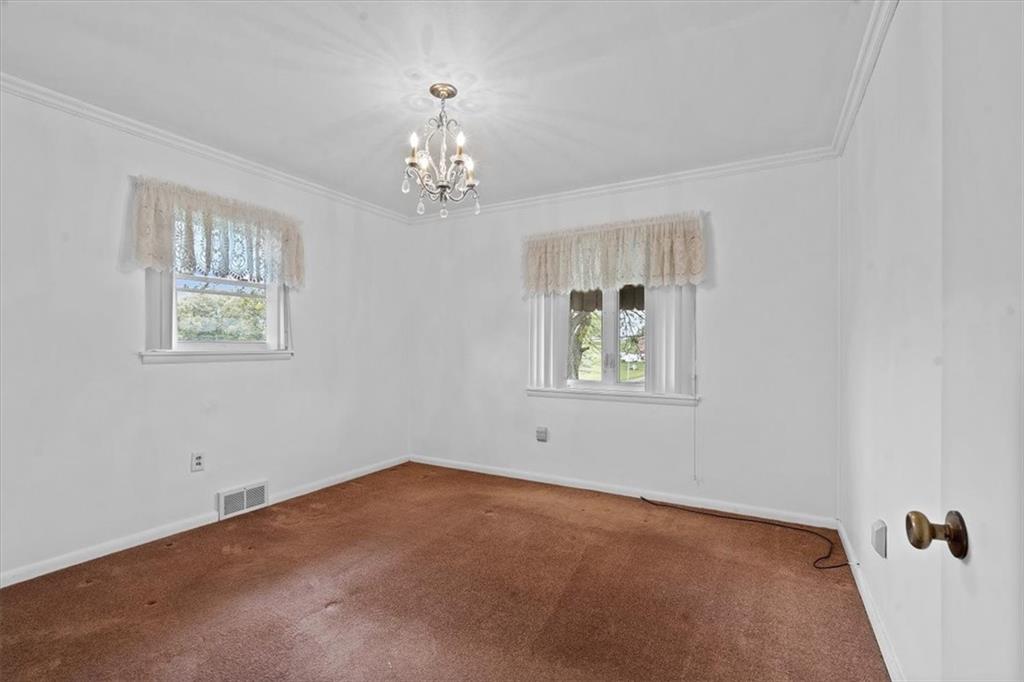 726 Winfield Road Cabot, PA 16023 - Photo 10 of 25 a view of an empty room with a window