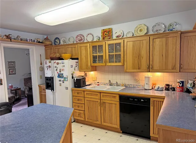 a kitchen with stainless steel appliances a stove and cabinets