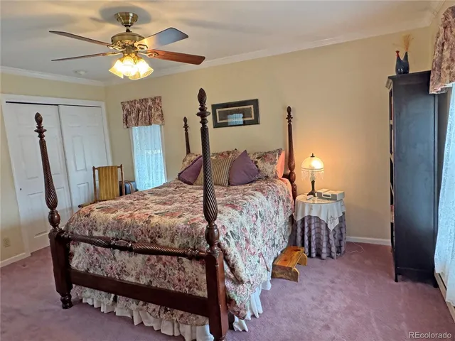 a bedroom with a bed and a dresser in it