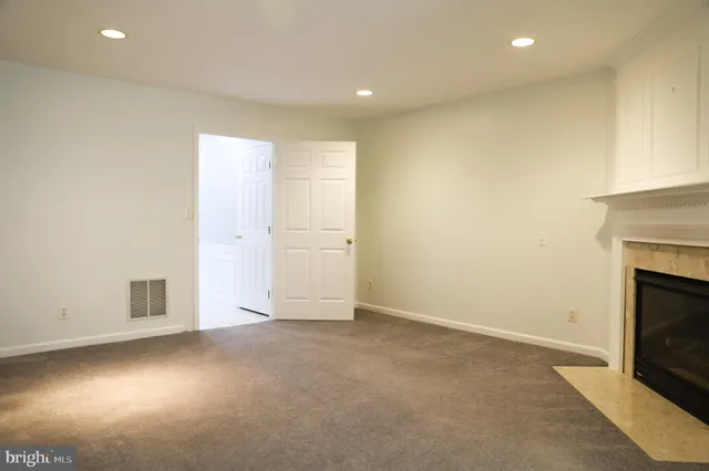 an empty room with fireplace