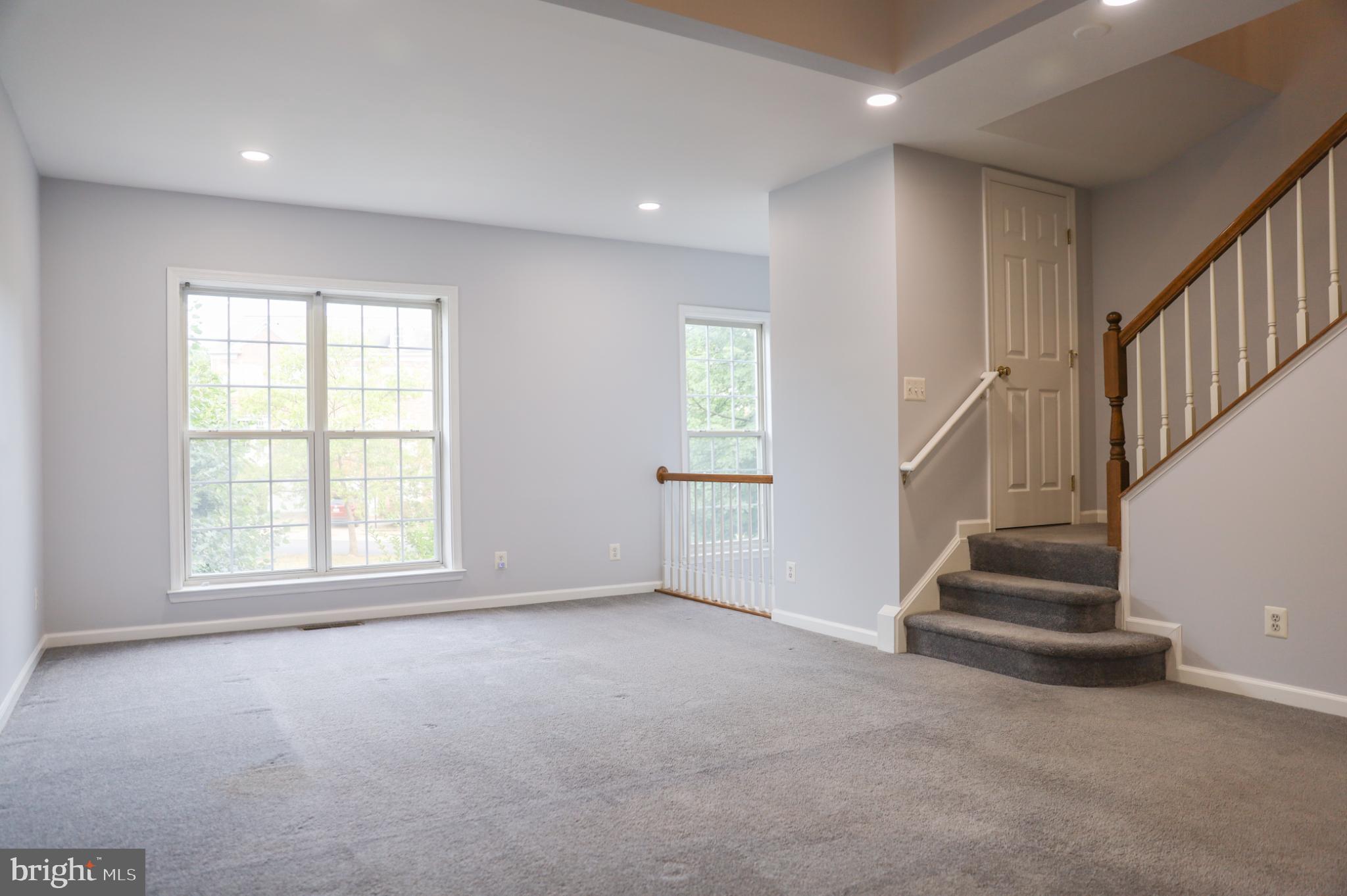 6324 Locust Tree Lane Alexandria, VA 22312 - Photo 7 of 21 a view of an empty room with stairs
